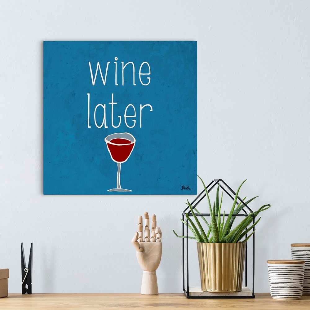 A bohemian room featuring "Wine Later" on a square blue background.