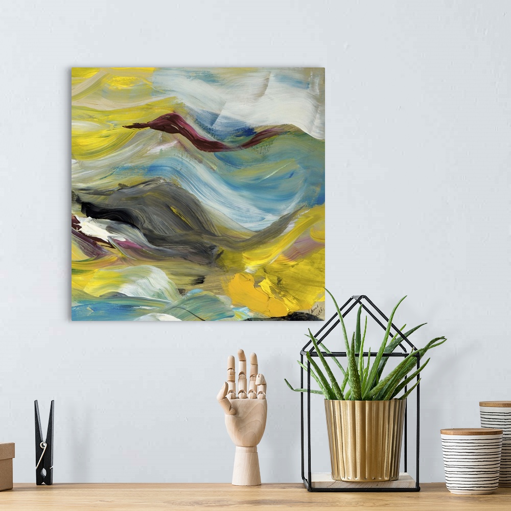 A bohemian room featuring Contemporary abstract artwork in flowing yellow, grey, and blue tones.