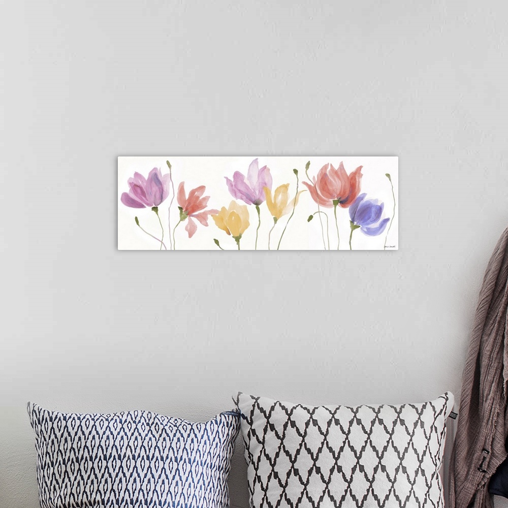 A bohemian room featuring A long horizontal watercolor painting of colorful Spring flowers in a row.