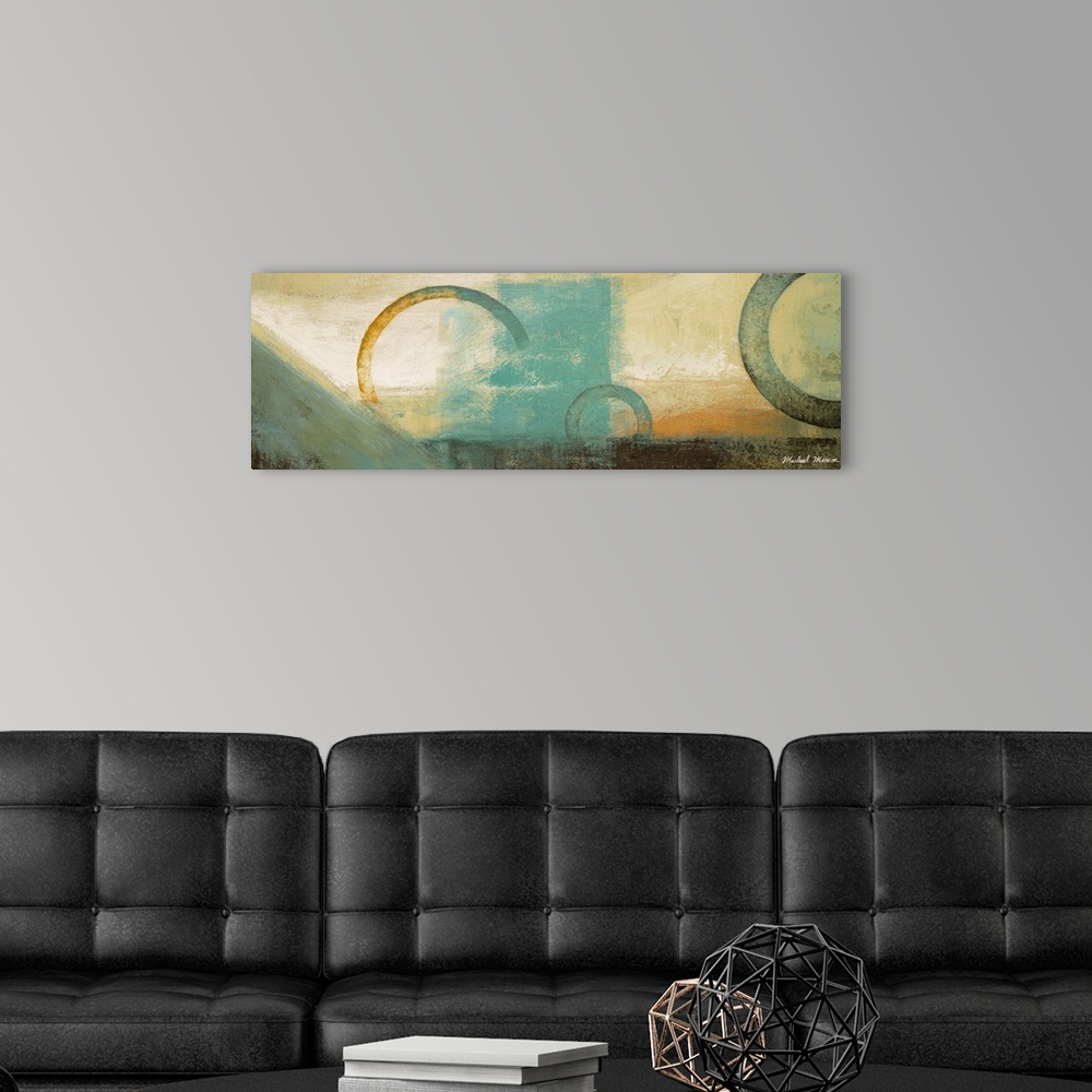A modern room featuring Panoramic abstract artwork that uses blocks of colors and rings of different sizes over those blo...