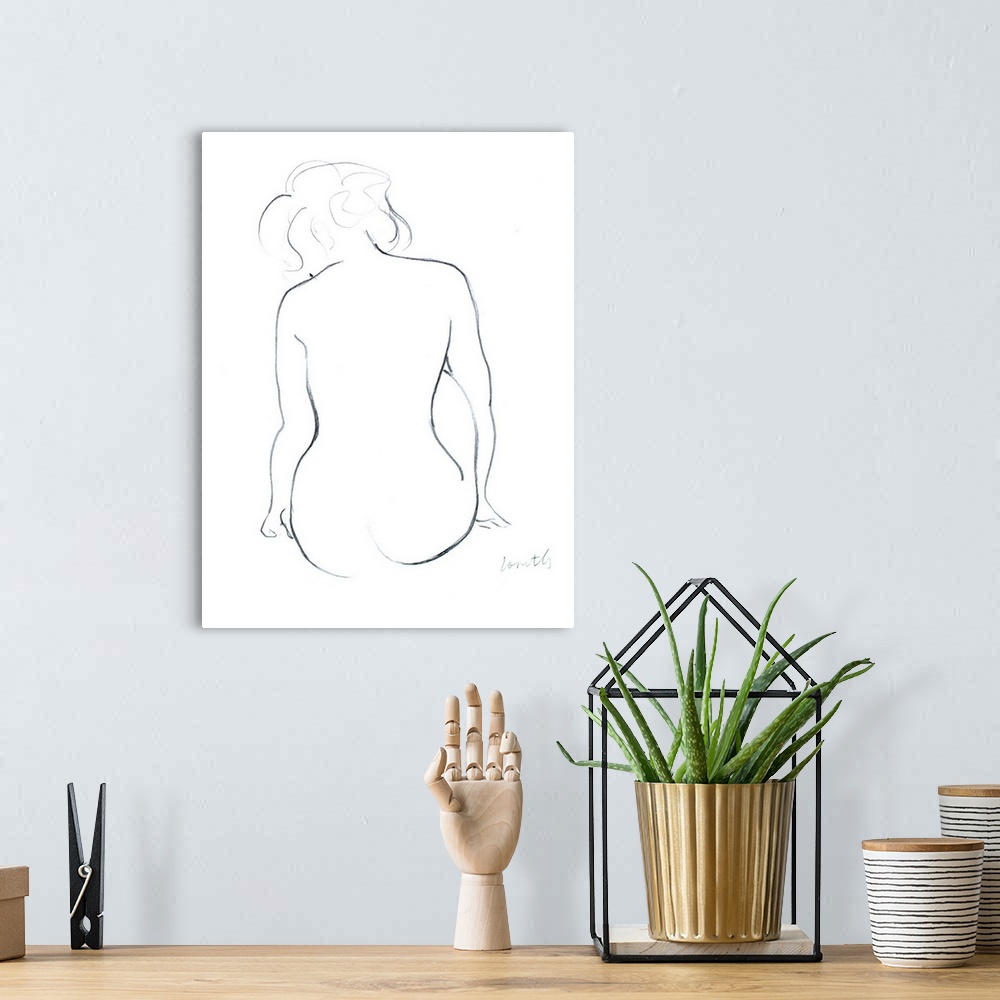 A bohemian room featuring This contemporary artwork features elegant simple lines to carve out a female figure.