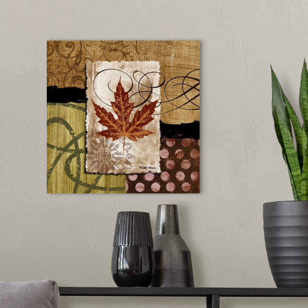 A modern room featuring A fall leaf framed with various earth-toned patterns and prints.