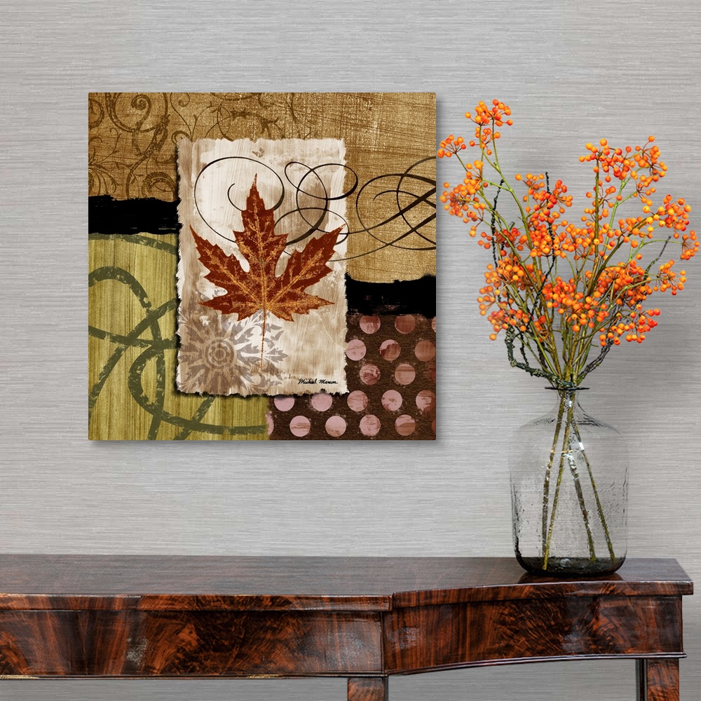 A traditional room featuring A fall leaf framed with various earth-toned patterns and prints.
