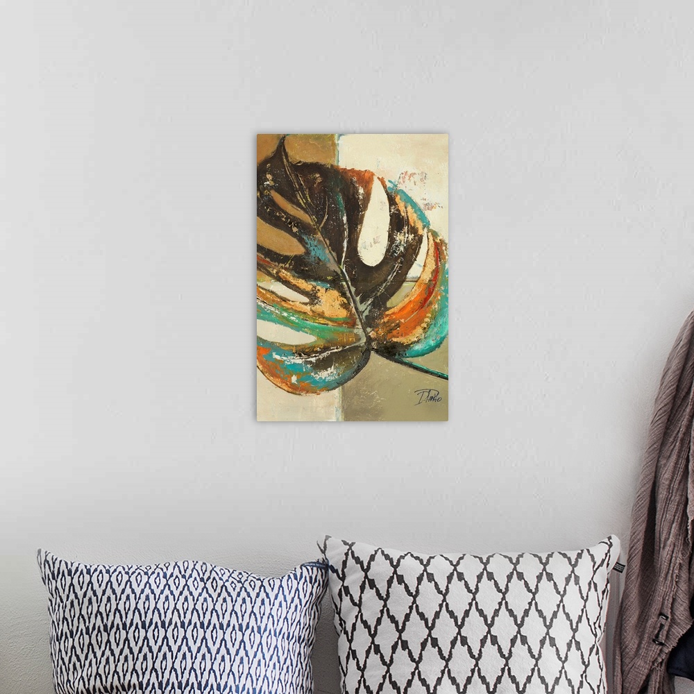 A bohemian room featuring A contemporary painting of a single colorful leaf with a tan squared background.