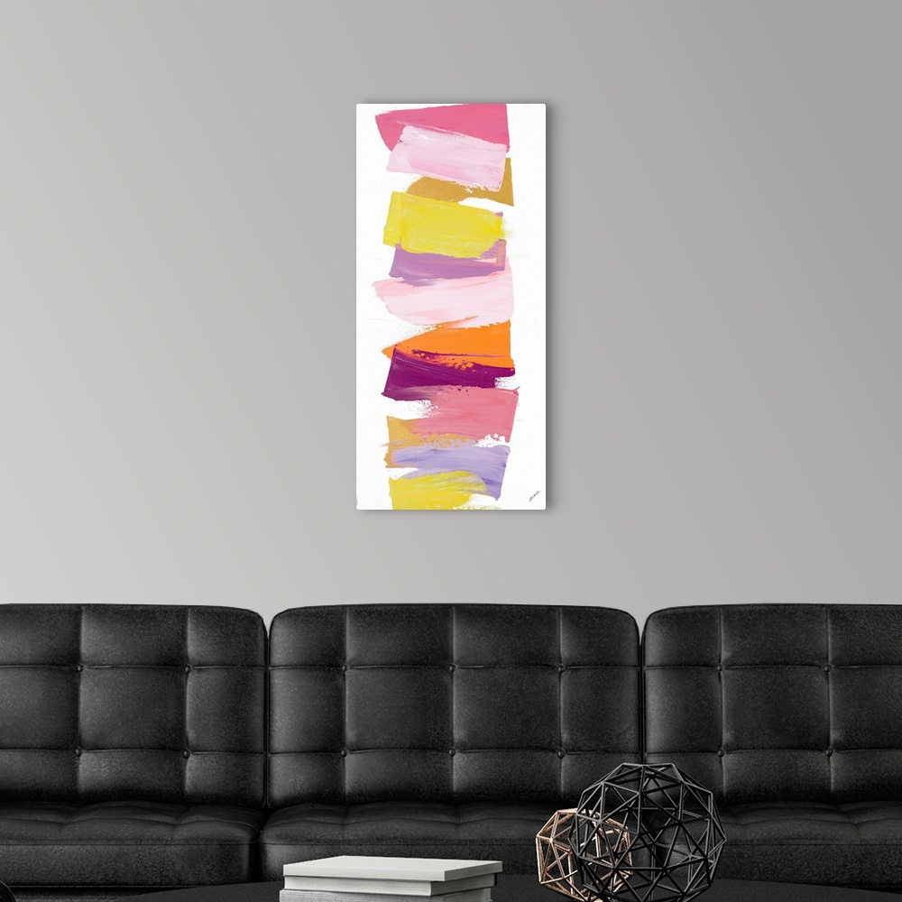 A modern room featuring Vertical contemporary painting of shades of pink and yellow stacked in a line.