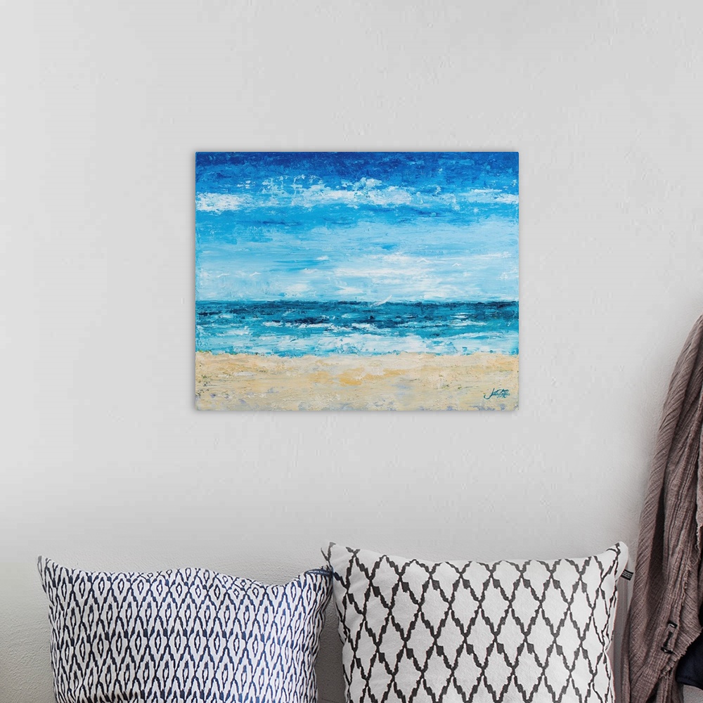 A bohemian room featuring A contemporary abstract painting of the beach with bright blue tones.