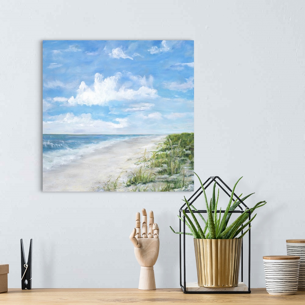 A bohemian room featuring Contemporary square painting of a sandy beach with waves crashing onto the shore.