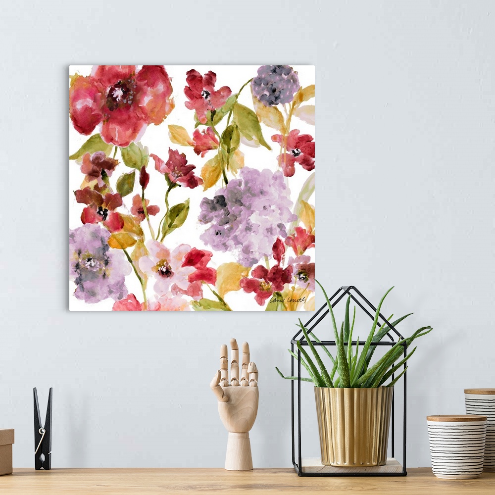 A bohemian room featuring A floral watercolor painting with both dark and light hues.