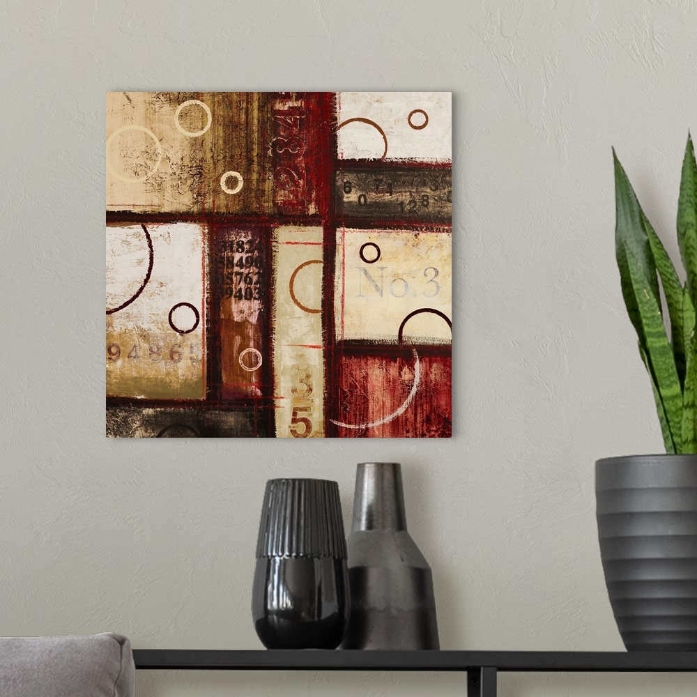 A modern room featuring Contemporary abstract art of blocks and circles of dark colors laid overtop of digital numbers.