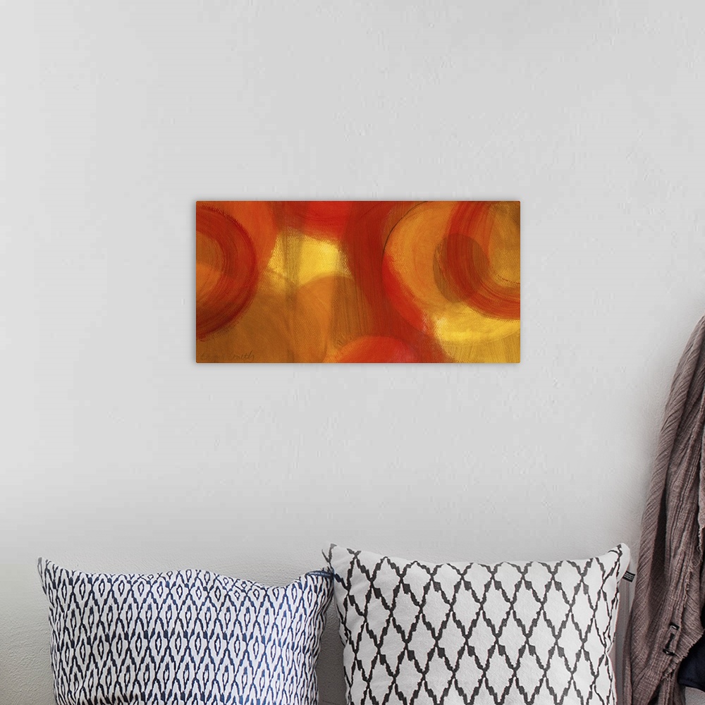 A bohemian room featuring Long abstractly painted canvas with patches of warm color with circles painted around.
