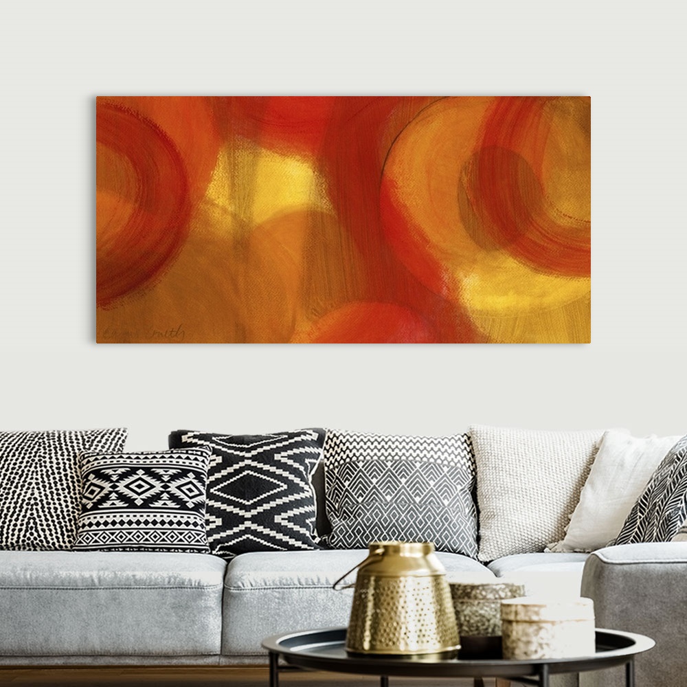 A bohemian room featuring Long abstractly painted canvas with patches of warm color with circles painted around.