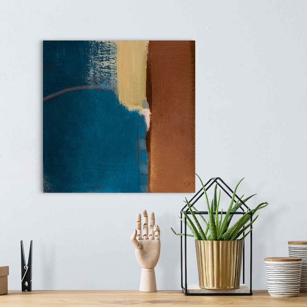 A bohemian room featuring Abstract artwork in blue and brown.