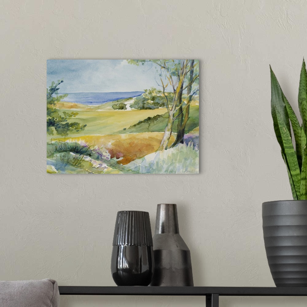 A modern room featuring Watercolor landscape painting of trees and bushes overlooking the ocean.