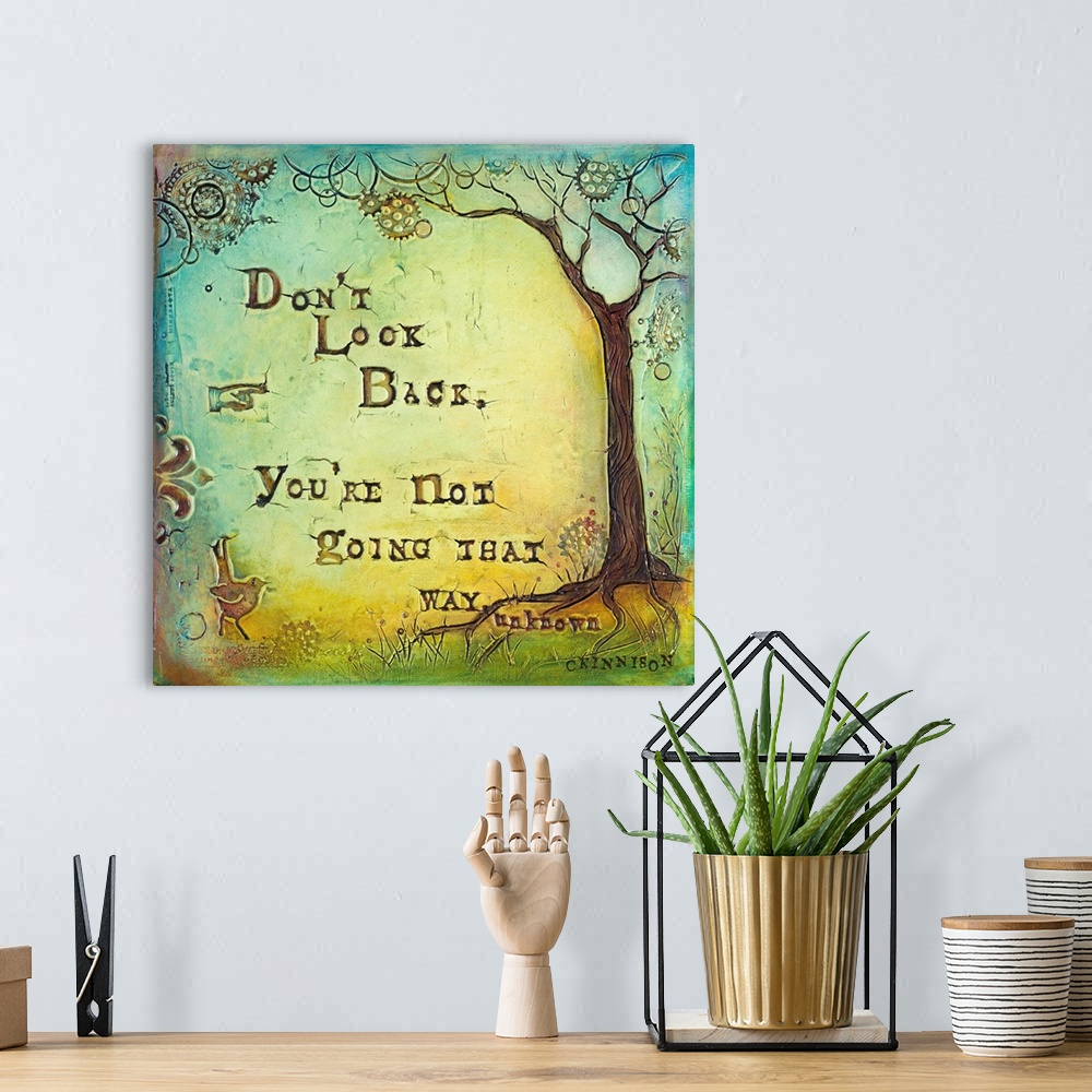 A bohemian room featuring Inspirational sentiment over a painting of a tree with circular shapes in the branches.