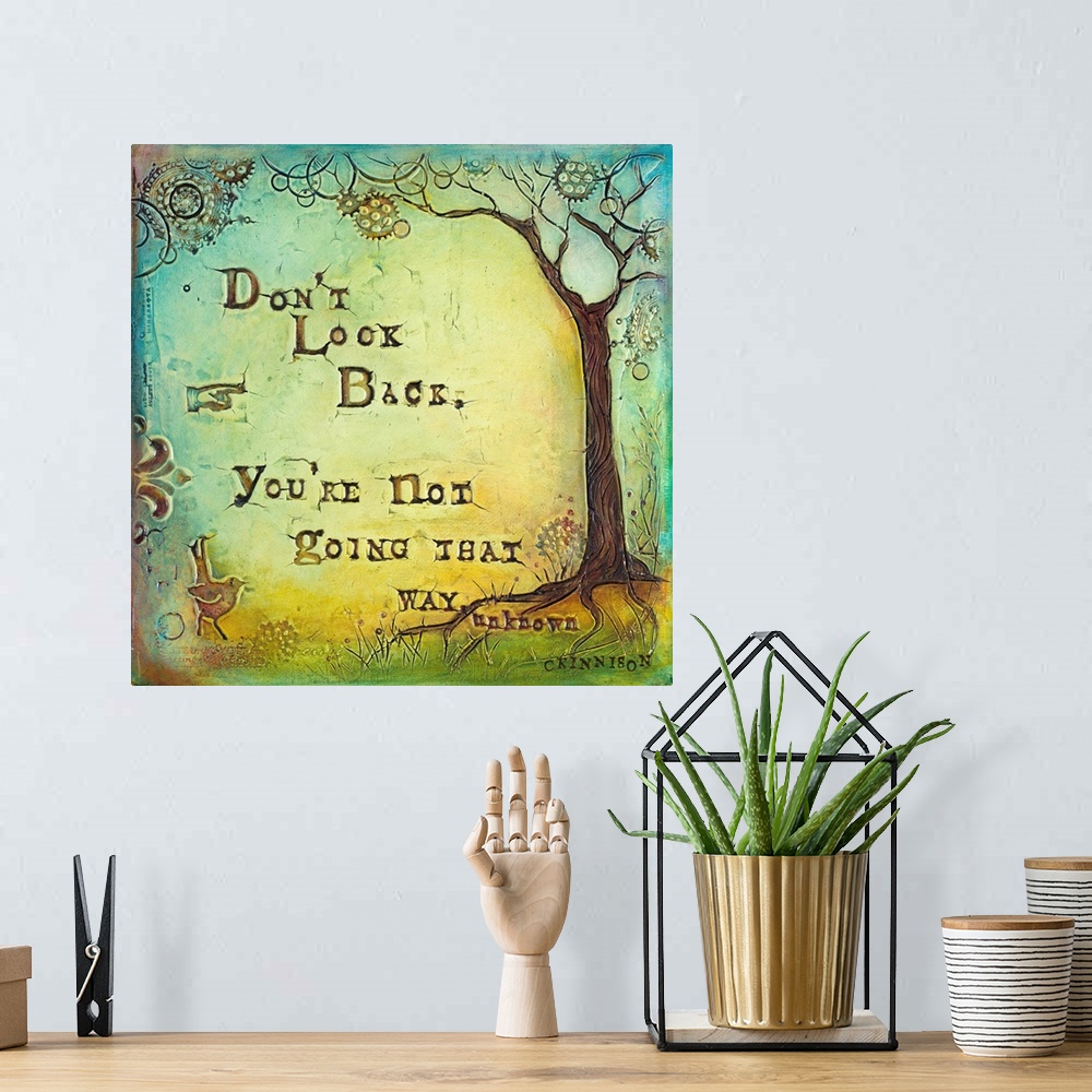A bohemian room featuring Inspirational sentiment over a painting of a tree with circular shapes in the branches.