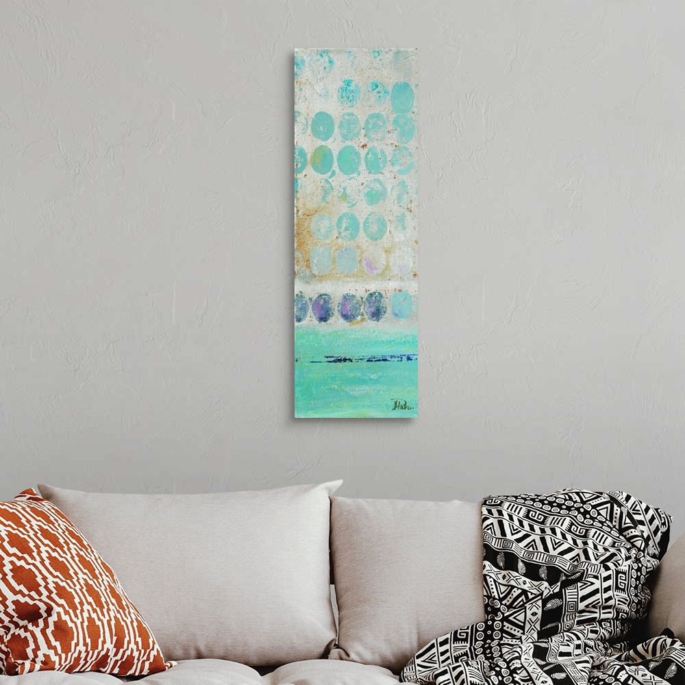 A bohemian room featuring Painting of a turquoise dots against a beige background.