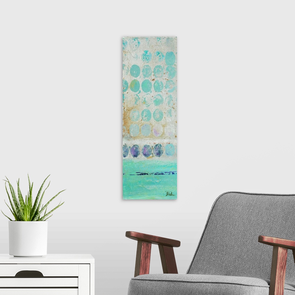 A modern room featuring Painting of a turquoise dots against a beige background.