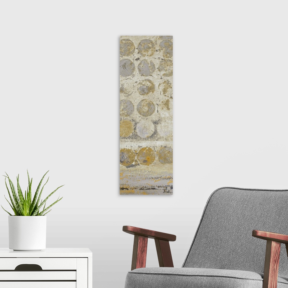 A modern room featuring Painting of a beige dots against a gray background.