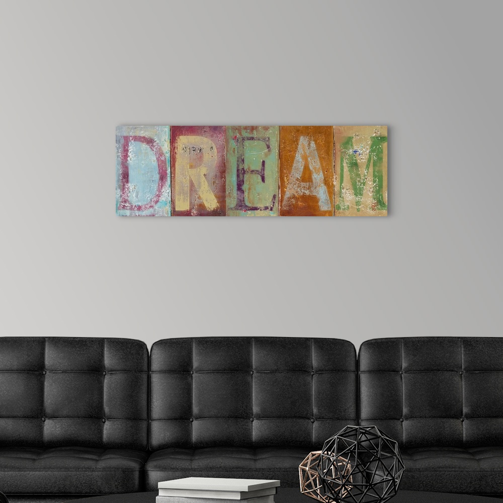 A modern room featuring Horizontal typographic artwork of distressed painted letters spelling out an inspirational word.