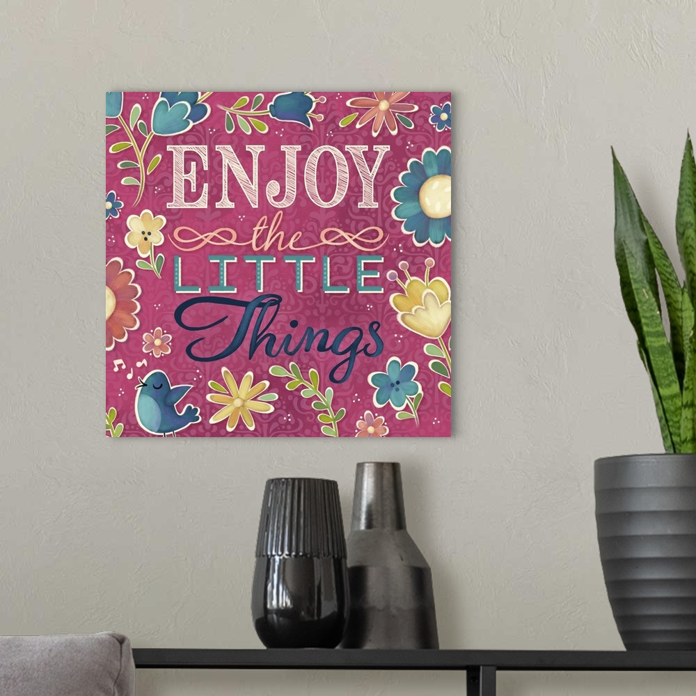 A modern room featuring "Enjoy the Little Things" surrounded by flowers and a blue bird.