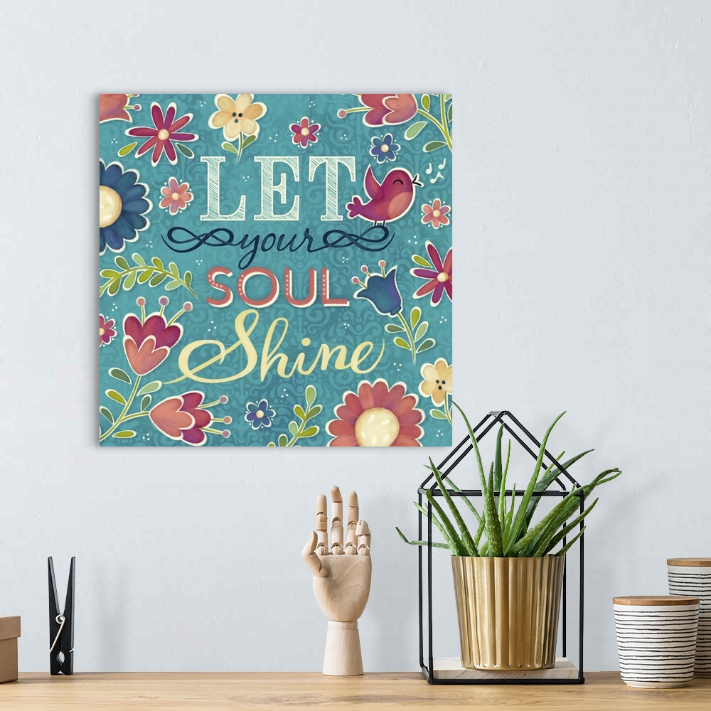 A bohemian room featuring "Let You Soul Shine" surrounded by flowers and a pink bird.