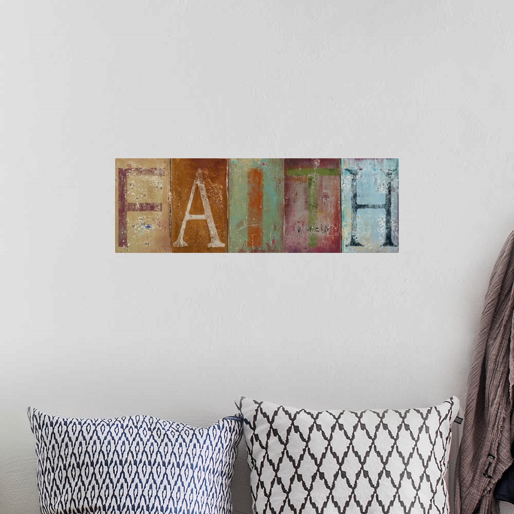 A bohemian room featuring Long painting on canvas of the letters of the word "faith" on each block of color.