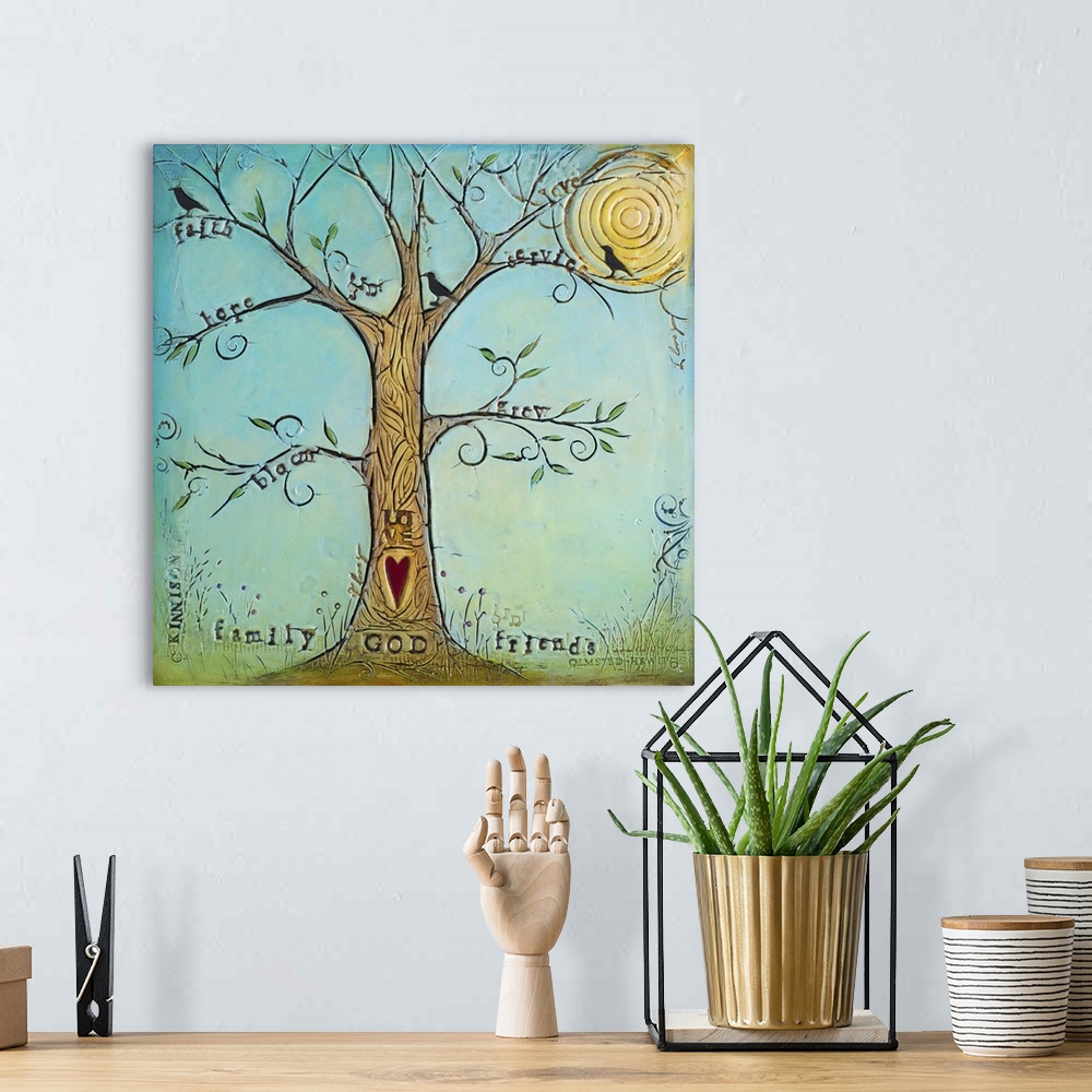 A bohemian room featuring A tree with family-themed words on the branches and a heart on the trunk.