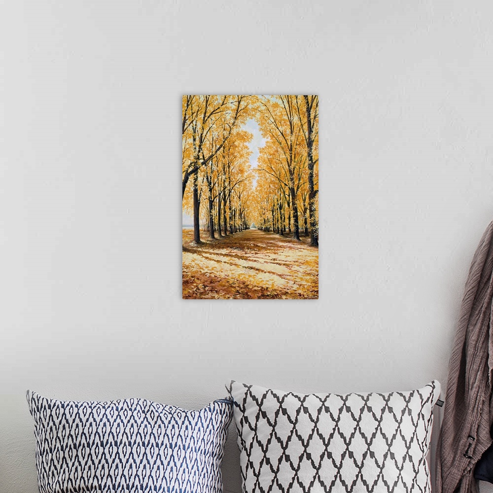 A bohemian room featuring Large print of a path lined with brightly colored fall trees.