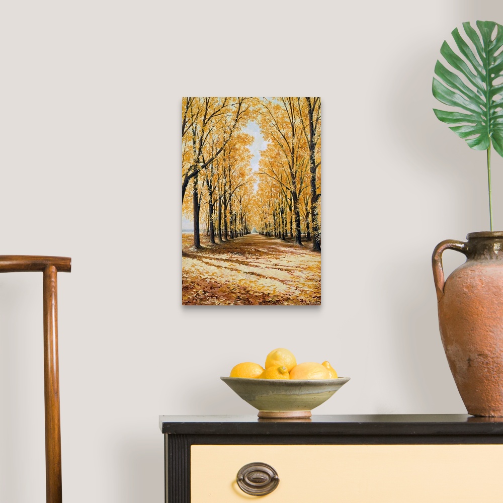 A traditional room featuring Large print of a path lined with brightly colored fall trees.
