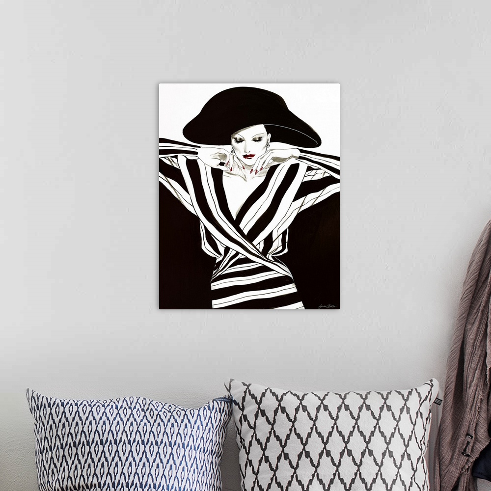 A bohemian room featuring Fashion artwork of a woman wearing black and stripes and large black hat.