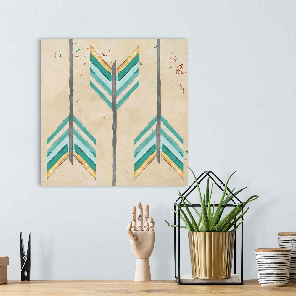 A bohemian room featuring A painting with three arrow feathers with teal and gold hues on a tan background.