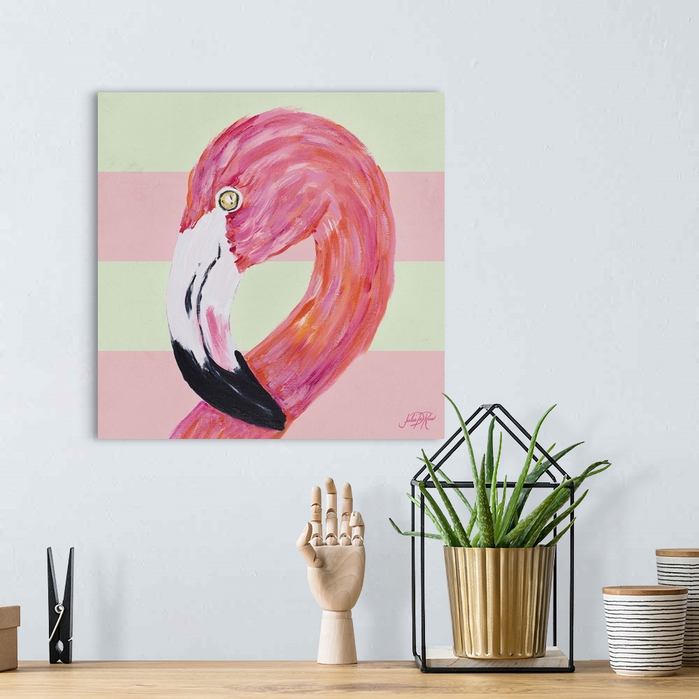 A bohemian room featuring A painting of a pink flamingo with a pale pink and cream striped background.