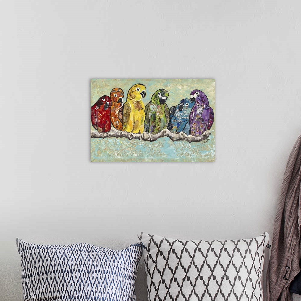 A bohemian room featuring A painting of macaws and conures on a branch, each in a different color, forming a rainbow.