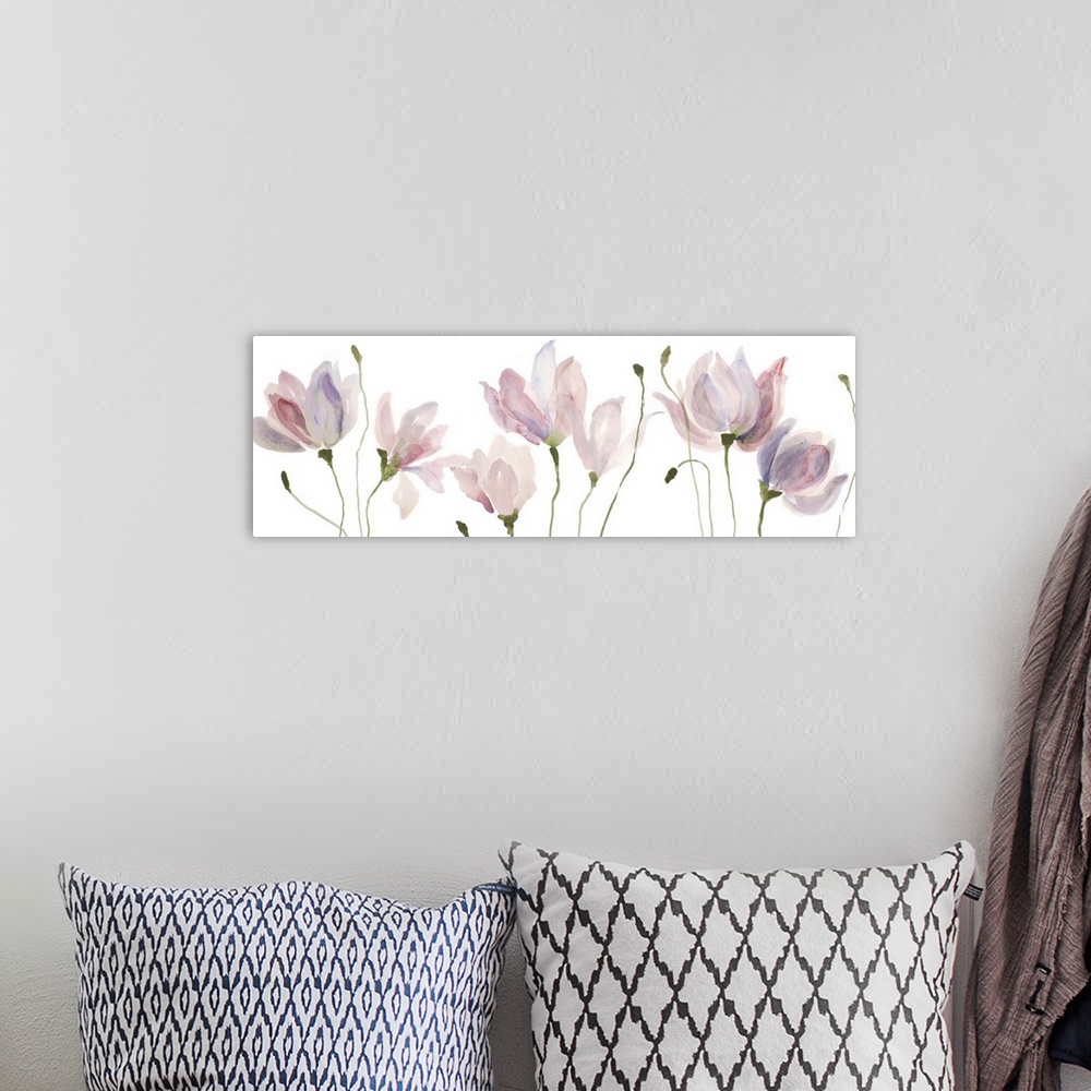 A bohemian room featuring A long horizontal watercolor painting of pink and violet flowers in a row.