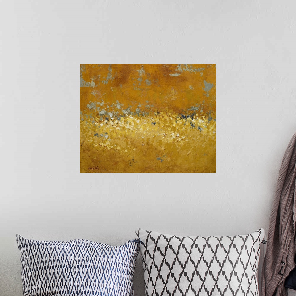 A bohemian room featuring Abstract painting done in golden tones, creating a semblance of a field of wildflowers at sunset.
