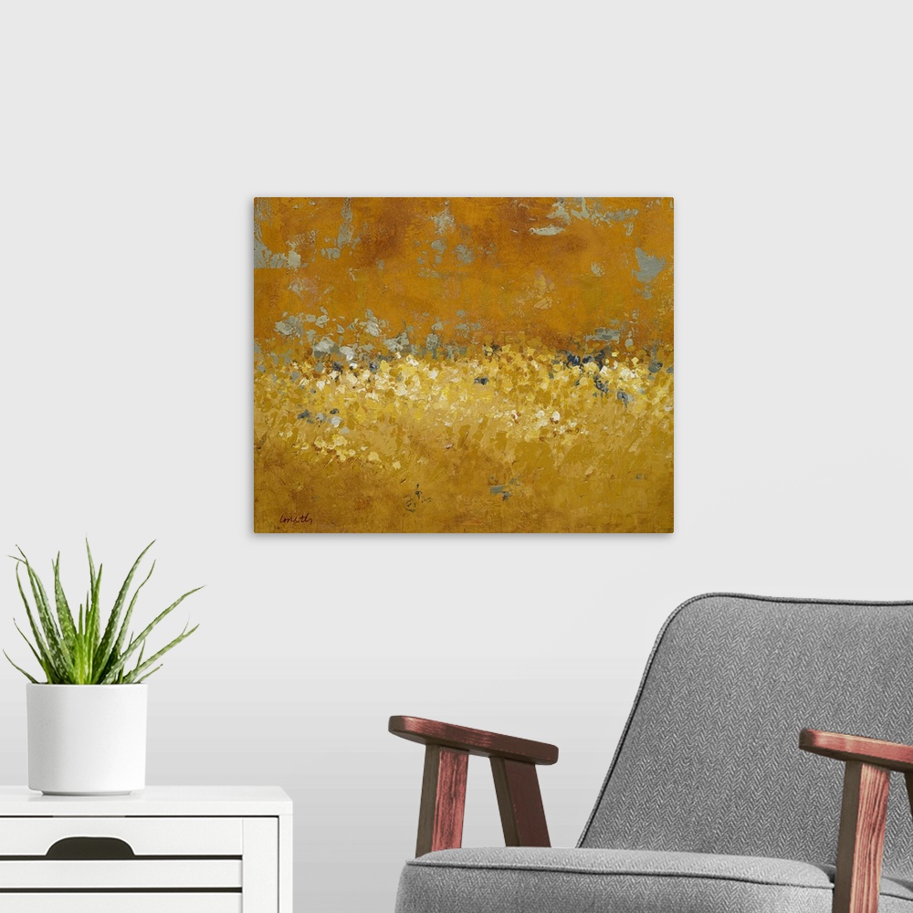 A modern room featuring Abstract painting done in golden tones, creating a semblance of a field of wildflowers at sunset.