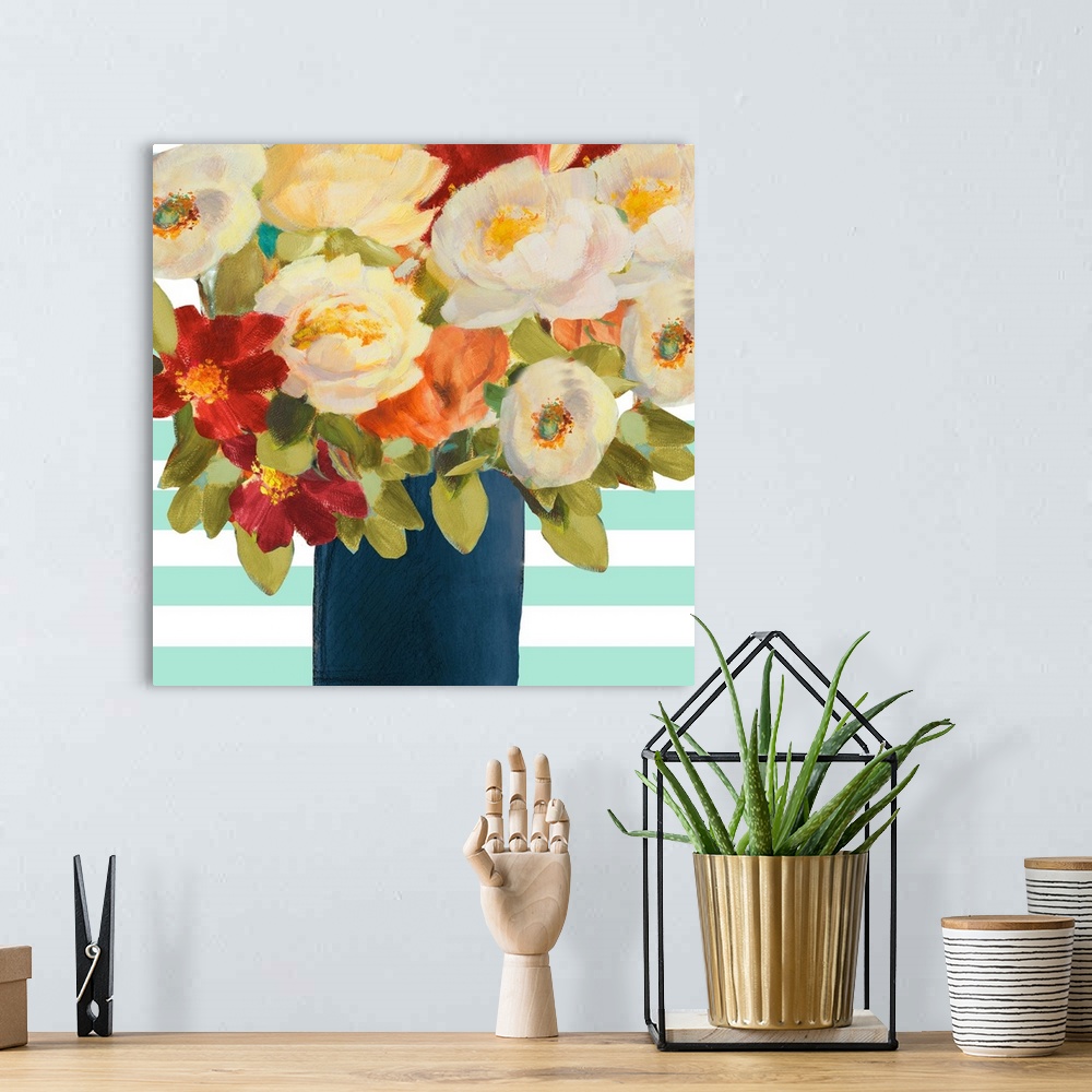 A bohemian room featuring Painting of several colorful flowers in a dark blue vase.