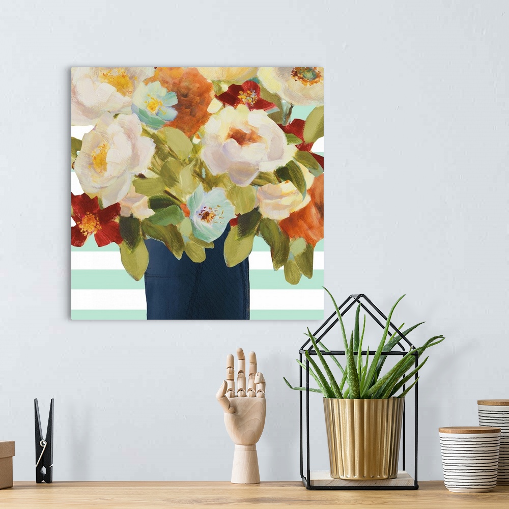 A bohemian room featuring Painting of several colorful flowers in a dark blue vase.