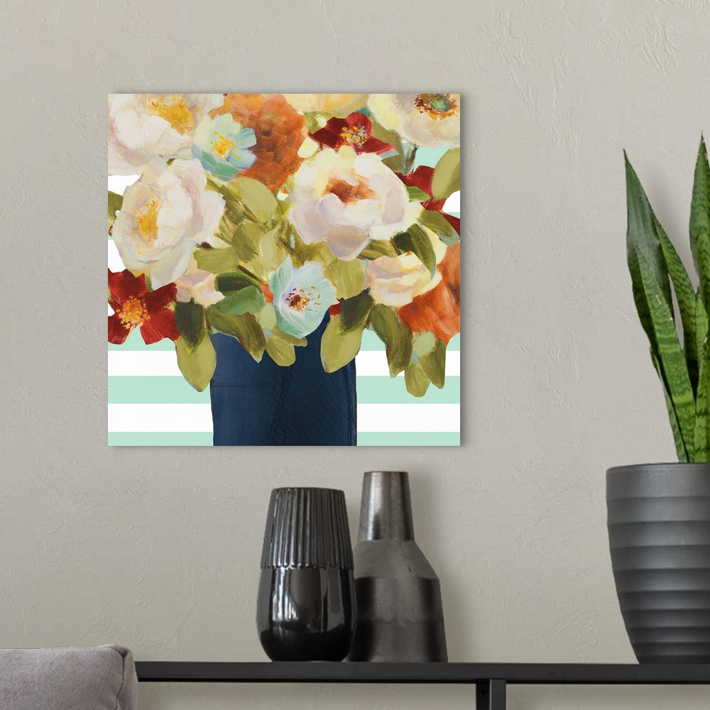 A modern room featuring Painting of several colorful flowers in a dark blue vase.