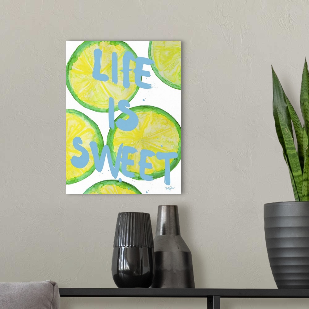 A modern room featuring "Life is sweet" written over painted lime slices.