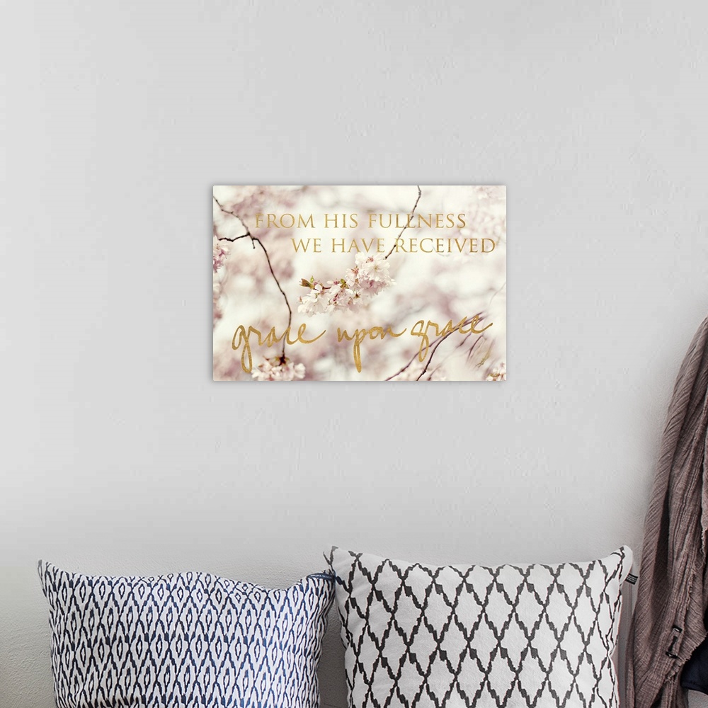 A bohemian room featuring Shallow depth of field photograph of cherry blossom branches and the phrase "From His fullness we...