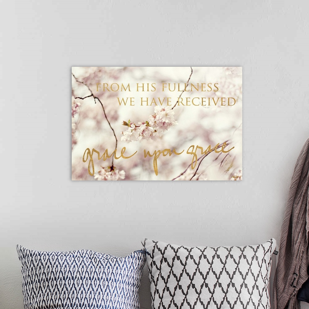 A bohemian room featuring Shallow depth of field photograph of cherry blossom branches and the phrase "From His fullness we...