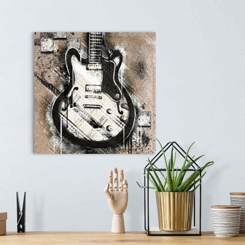 A bohemian room featuring Artwork of a black and white guitar that appears to be spray painted on a neutral colored wall wi...