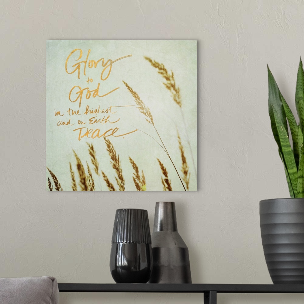 A modern room featuring Square photograph of the tips of beach grass swaying in the wind with the quote "Glory to God in ...