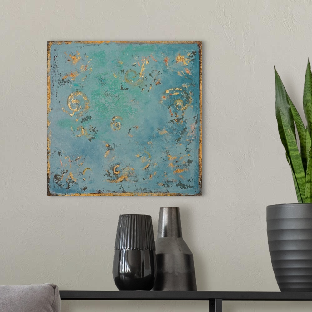 A modern room featuring A contemporary abstract painting of gold swirls on a blue background with hints of green.