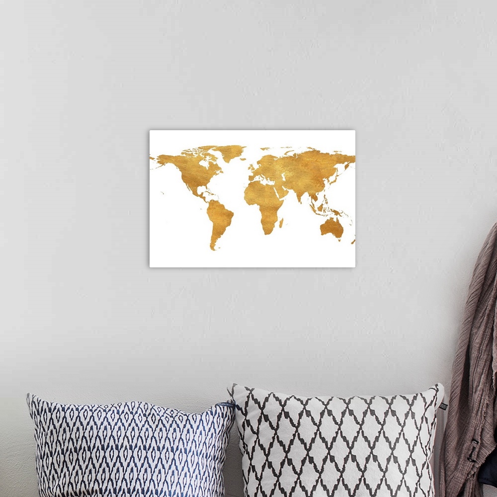 A bohemian room featuring A shiny gold map of the World on a solid white background.
