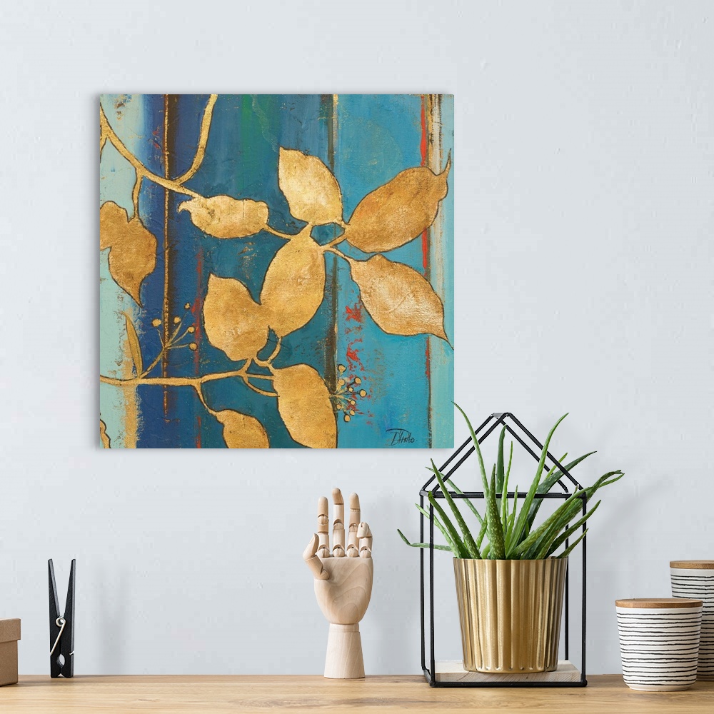 A bohemian room featuring Contemporary painting with an abstract blue background with gold silhouetted leaves in the foregr...