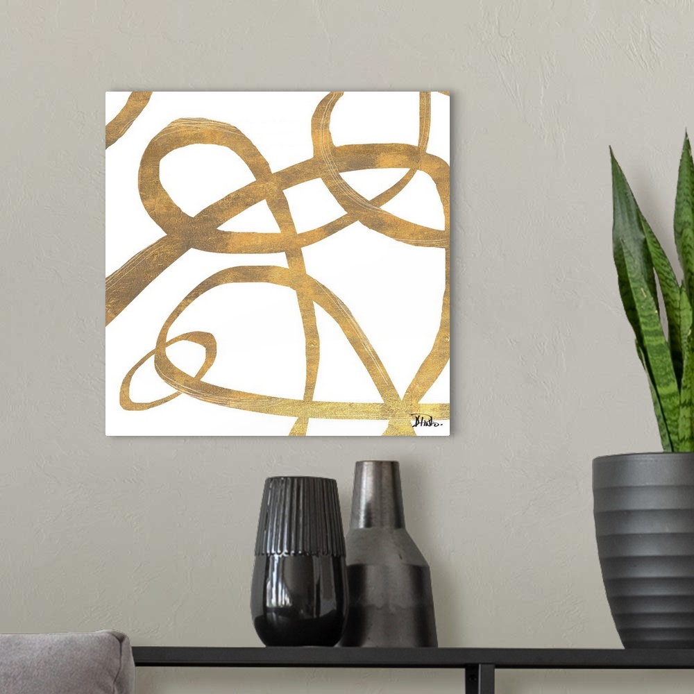 A modern room featuring Contemporary abstract artwork of gold swirling lines in circling movements against a white backgr...