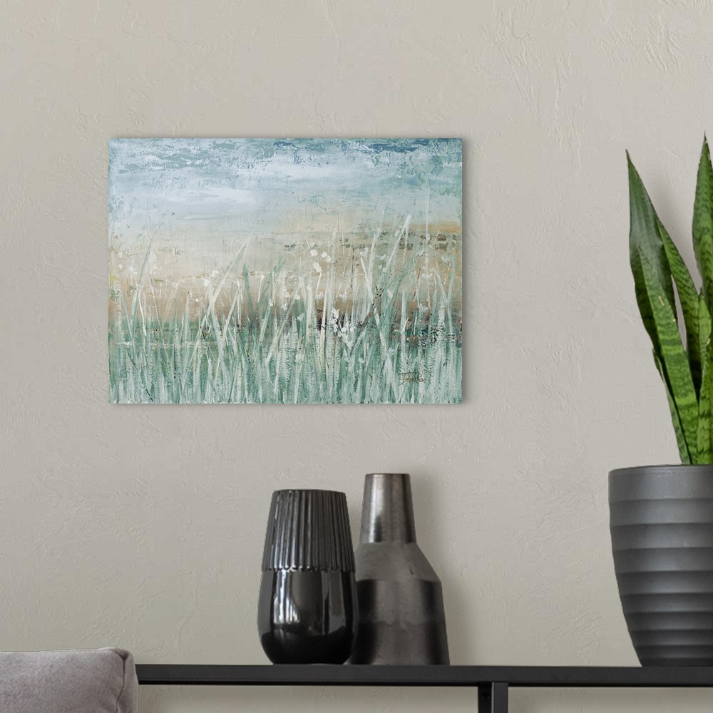 A modern room featuring A contemporary landscape painting with muted blue and green hues and tall grass in the foreground.