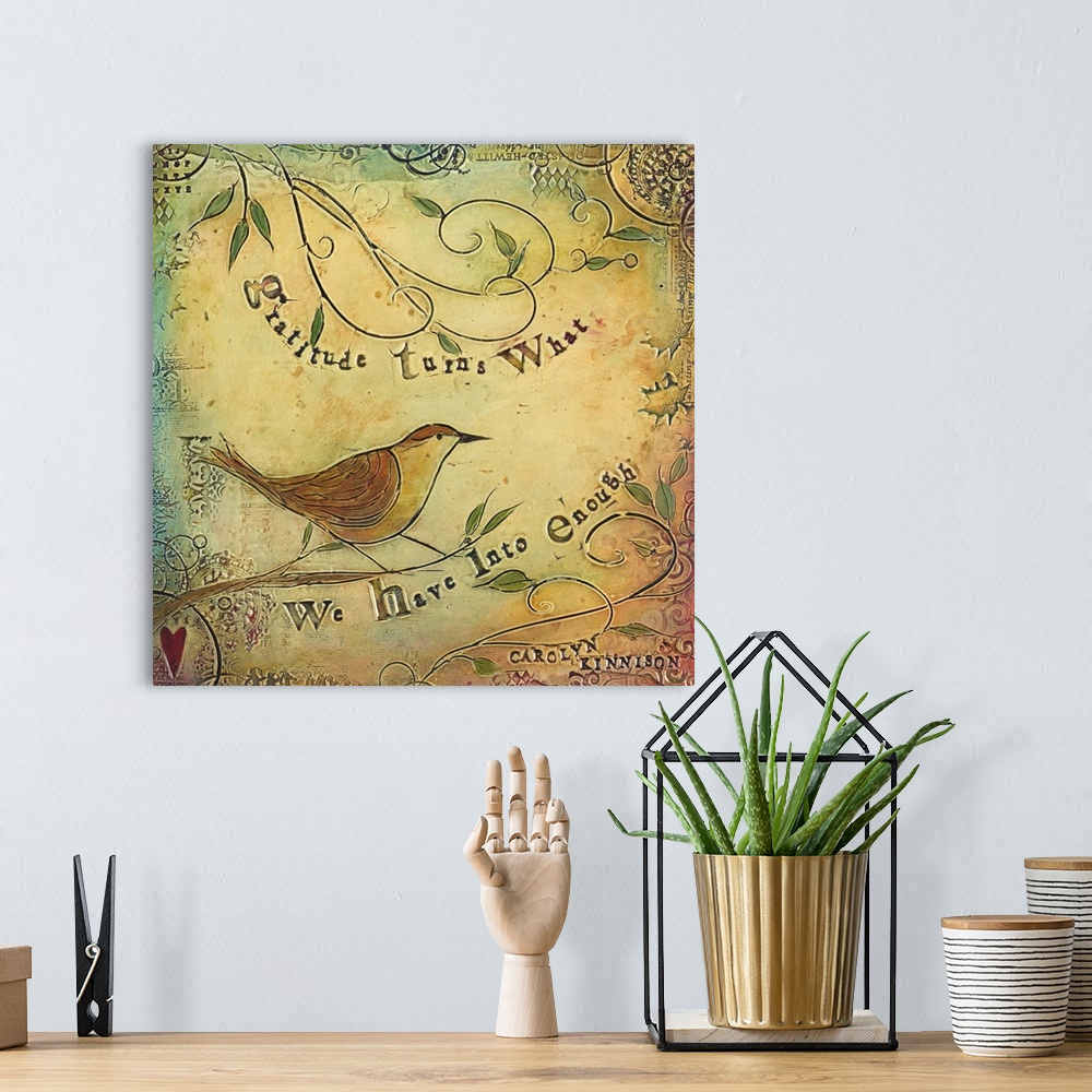 A bohemian room featuring An inspirational sentiment over a painting of a bird on curly branches.